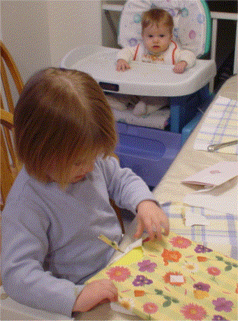 Buddy watches Caroline open her presents
